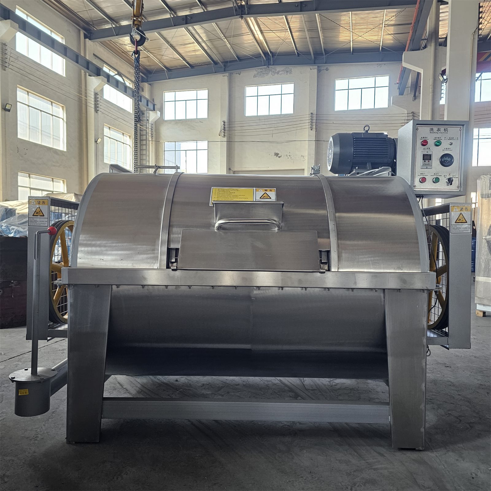 Side view of stainless steel horizontal washing machine